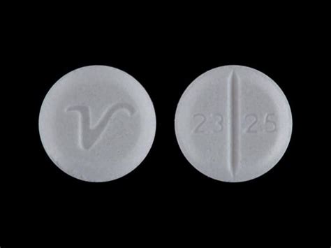 Enter the imprint code that appears on the pill. . White pill with v on one side